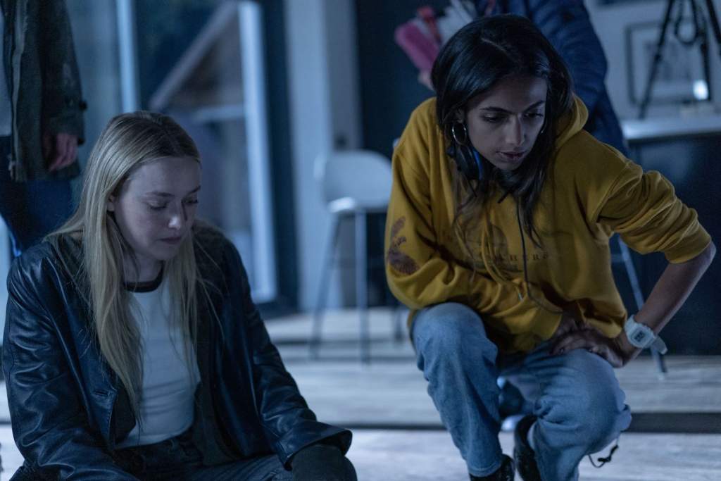 (L-r) DAKOTA FANNING and Director/Writer ISHANA SHYAMALAN on the set of New Line Cinema’s and Warner Bros. Pictures’ fantasy thriller “THE WATCHERS,” a Warner Bros. Pictures release. Copyright: © 2024 Warner Bros. Entertainment Inc. All Rights Reserved. Photo Credit: Jonathan Hession